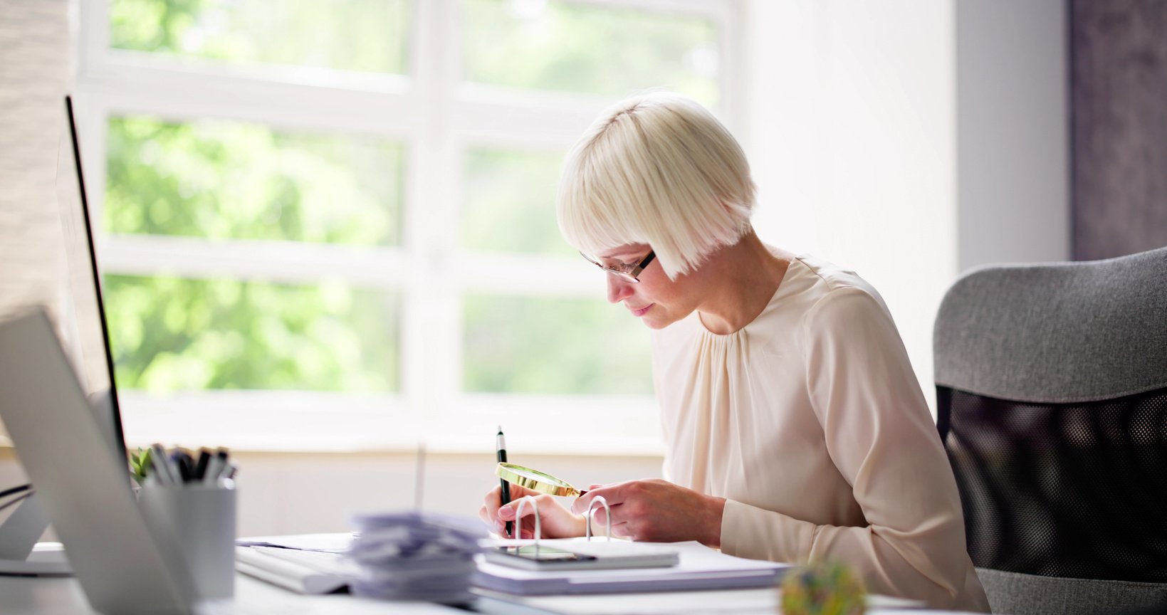 Corporate Auditor Using Magnifying Glass